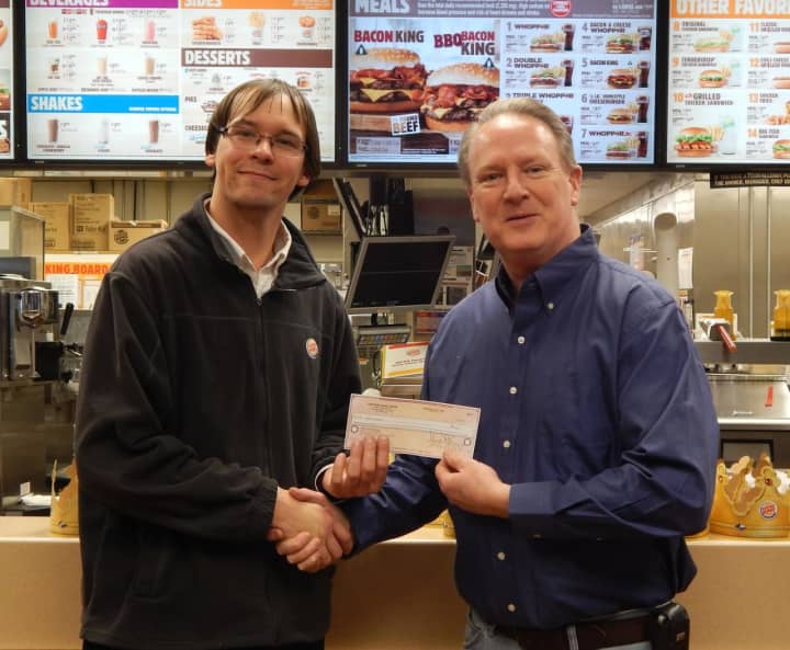 Matthew Fitzgerald, Burger King assistant manager, presents &quot;Dining to Donate&quot; donation to David Humphrey of Yorktown Community Help.