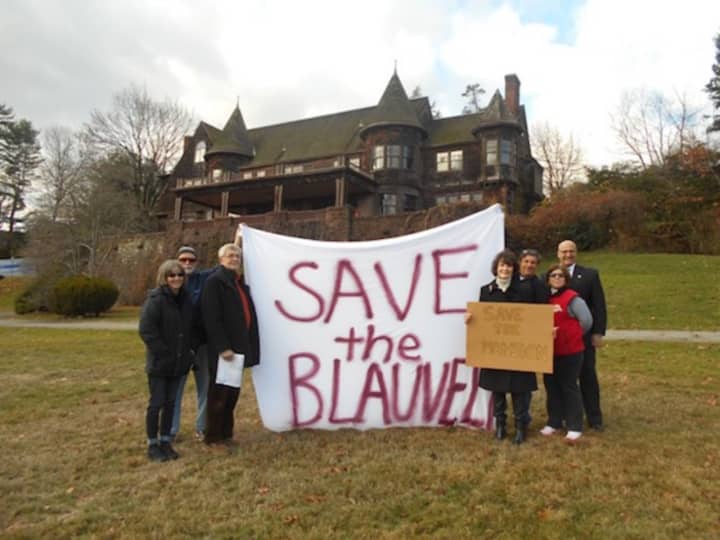 Activists protest the destruction of the Blauvelt Mansion.