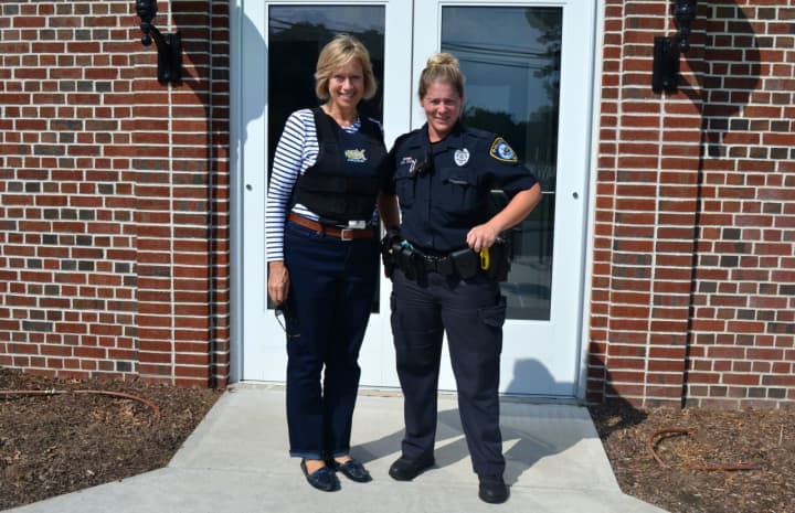 Rep. Terrie Wood participates in a ride-along with Darien Police Officer Leslie Silva last month.