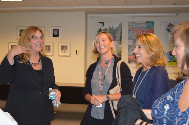 Incoming Fairfield Superintendent of Schools Toni Jones, left, shares a laugh with parents Wednesday.