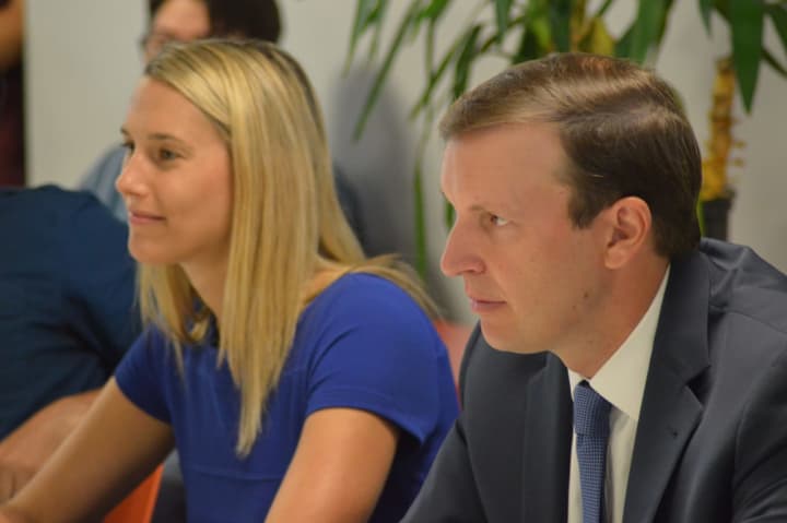 U.S. Sen. Chris Murphy listens to entrepreneurs at a roundtable discussion in Stamford Wednesday as State Rep. Caroline Simmons of Stamford looks on.