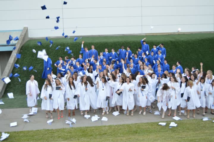 The Class of 2016 from Immaculate High School in Danbury celebrates after commencement exercises on Wednesday evening.