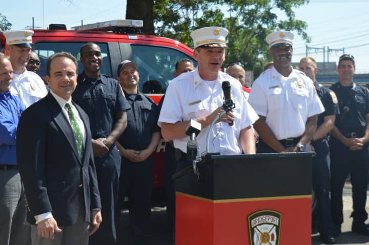 Bridgeport Fire Chief Richard Thode speaks about the new safety truck while Mayor Joe Ganim, left, looks on.