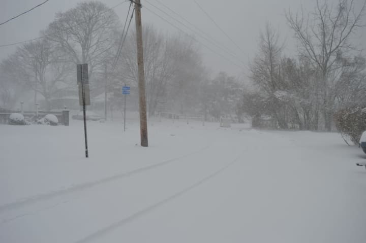 Snow was falling steadily at Hackley Street and Harbor Avenue in Bridgeport Thursday morning.