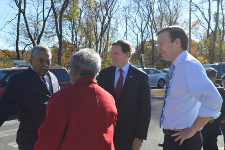 State Sens. Ed Gomes and Marilyn Moore chat with U.S. Sens. Richard Blumenthal and Chris Murphy outside Bridgeport&#x27;s Wilbur Cross School during voting on Tuesday.