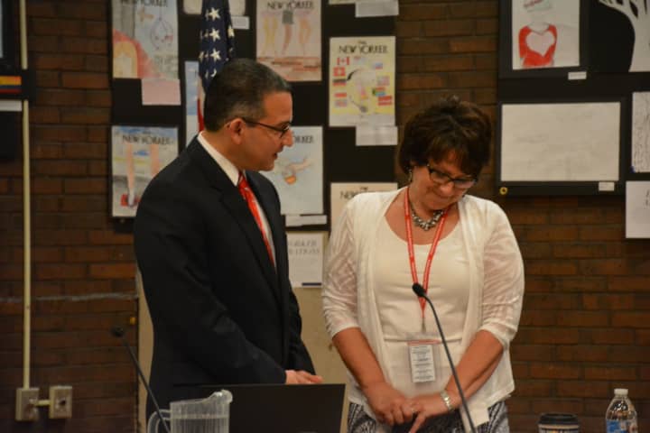 Christopher Manno is sworn in as Bedford Central&#x27;s new superintendent of schools. The oath is administered by District Clerk Carole LaColla.