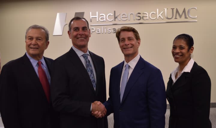 The presidents of Hackensack University Health Network, Robert Garrett (Center left) and Palisades Healthcare Systems (Bruce Markowitz) joined by Board of Governors members Joe Simunovich, left, and Theresa de Leon.