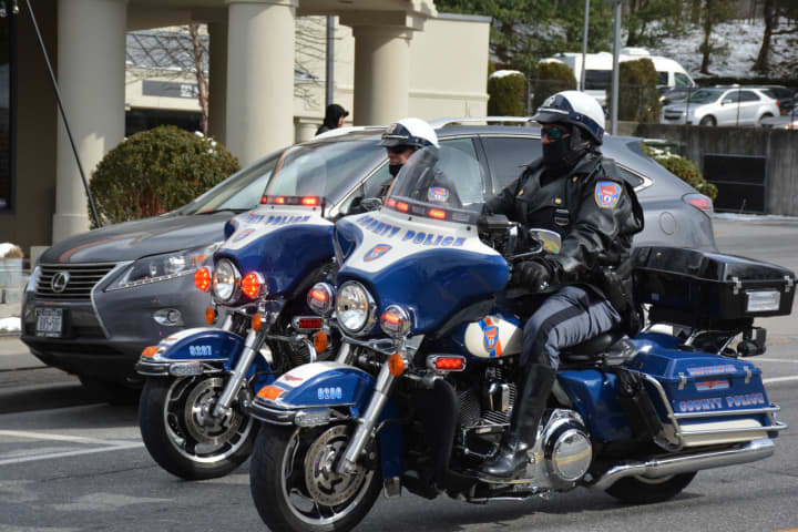 Westchester County Police on motorcycles ride in the Mount Kisco St. Patrick&#x27;s Day parade.