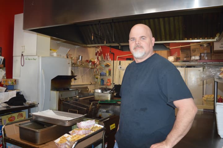 Jim Strohmeyer, Jr. works the grill in Jolly Nick&#x27;s in Dumont.