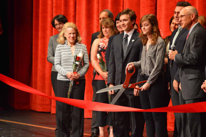 A student cuts the ribbon at the much-awaited Greenwich High School Performing Arts Center Wednesday evening, which has been years in the making.
