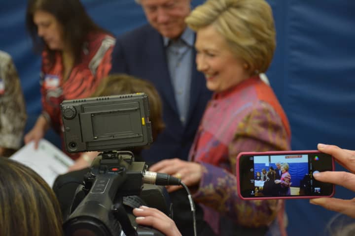 An array of cameras surround Hillary Clinton as she makes a stop at her polling place in Chappaqua to vote in the Democratic presidential primary last month.