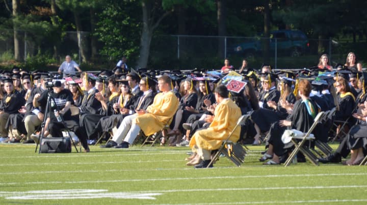 It&#x27;s a sea of black and yellow as the Class of 2016 assembles at Trumbull High for graduation Wednesday.