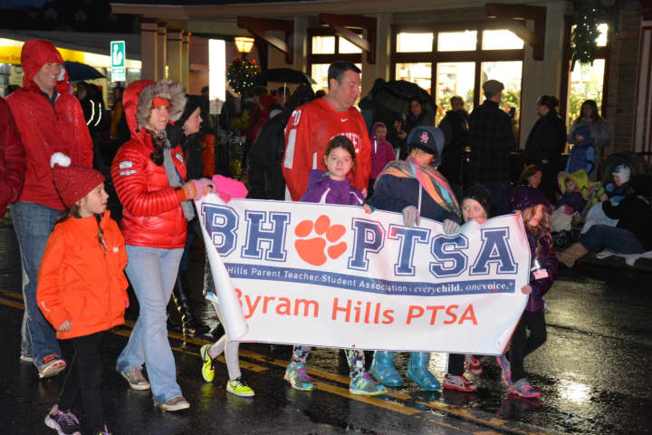 Members of the Byram Hills PTSA march in the &quot;Frosty Day&quot; parade in downtown Armonk.