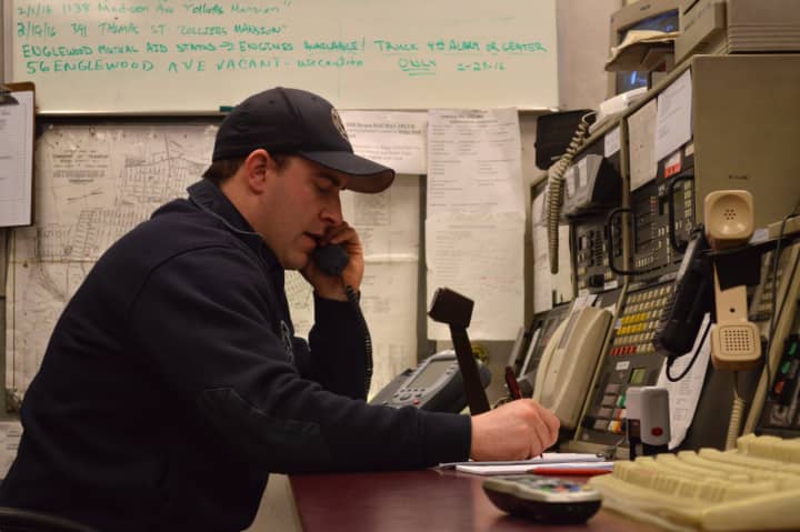 Brendan Sterbinsky, a Teaneck firefighter of five years, calls seniors in the morning to check that they are okay.