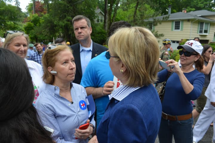 Hillary Clinton meets with a supporter in Chappaqua moments prior to the start of the 2016 Memorial Day parade. Area Democrats welcomed news this week that Clinton is their presumptive nominee for president.