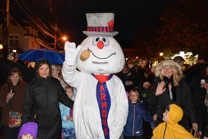 Frosty the Snowman marches through downtown Armonk as part of the hamlet&#x27;s annual &quot;Frosty Day&quot; celebration.