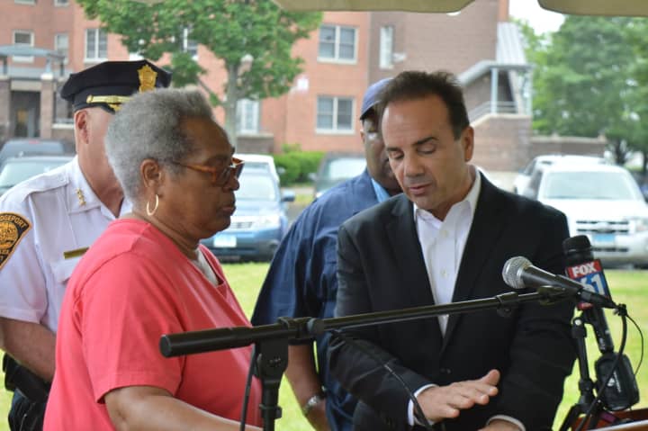 Bettie Cook, president of Bridgeport&#x27;s resident advisory board, speaks with Mayor Joe Ganim about a new police initiative in public housing complexes.