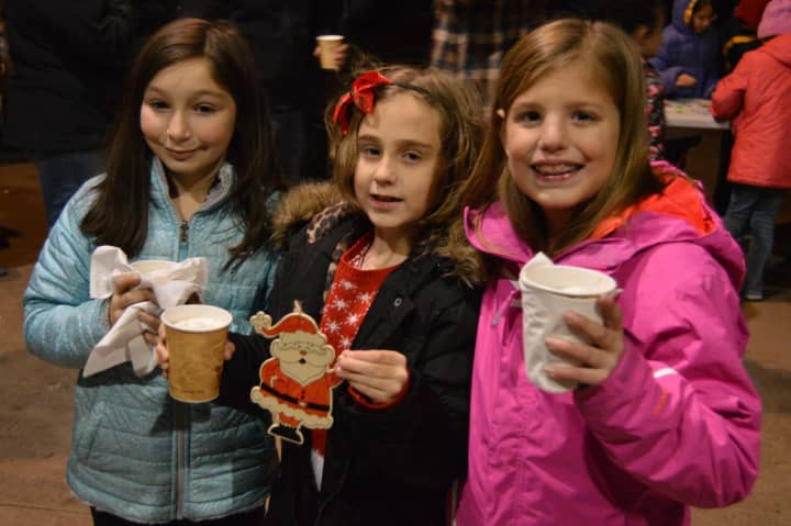 Kids, friends and families celebrate the third annual tree lighting at Shelton&#x27;s Veterans Memorial Park over the weekend.