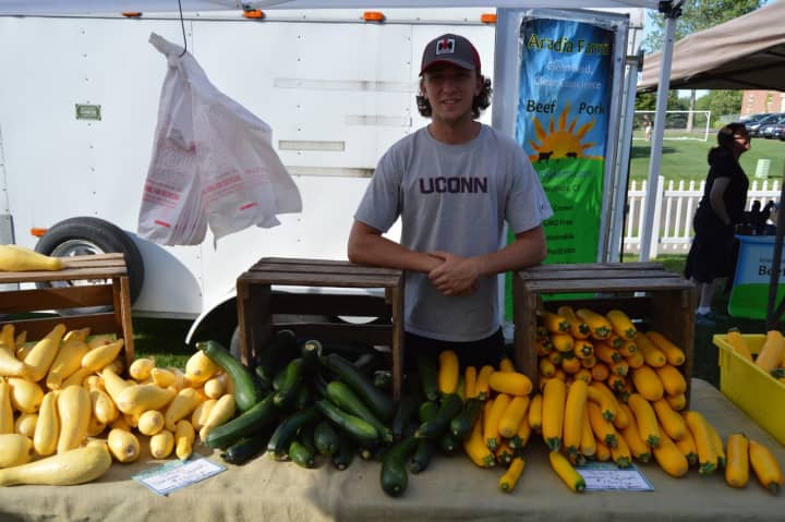 Nick Harper from Southbury&#x27;s Daffodil Hill Growers sells fresh vegetables at the Newtown Farmers Market.