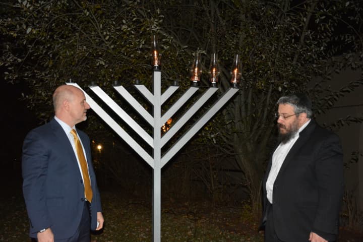 Rabbi Yosef Butman at the Chappaqua menorah lighting with New Castle Supervisor Rob Greenstein.