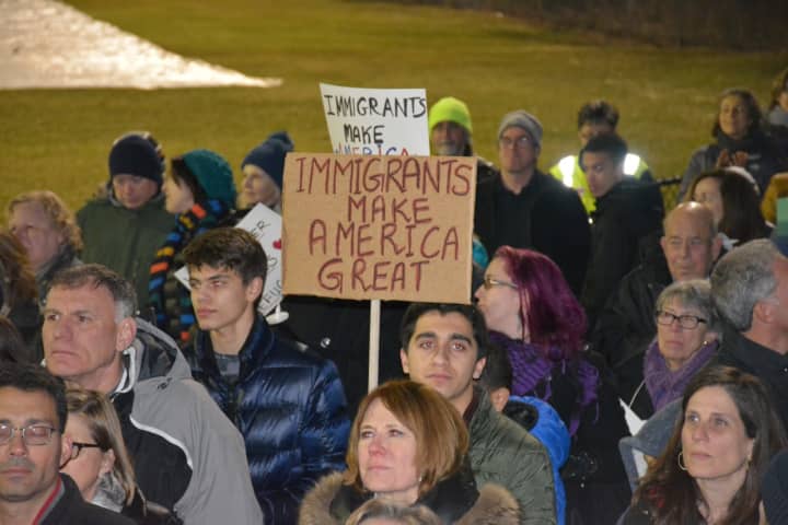 Demonstrators at an interfaith vigil in Chappaqua protest President Donald Trump&#x27;s ban on admitting refugees.