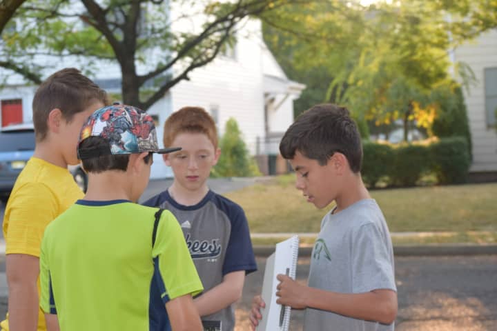 Benjamin Franklin Middle School sixth graders compare schedules before walking to school Wednesday.