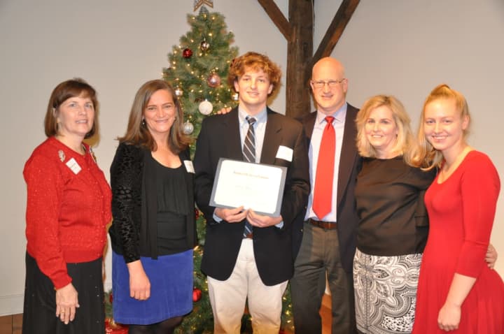 Connor Henry, accompanied by his parents Greg and Annie and sister Brittany, is presented the DAR Good Citizen Award by DAR Regent Katherine Love and DAR Good Citizen Award Chairman Kim Kiner