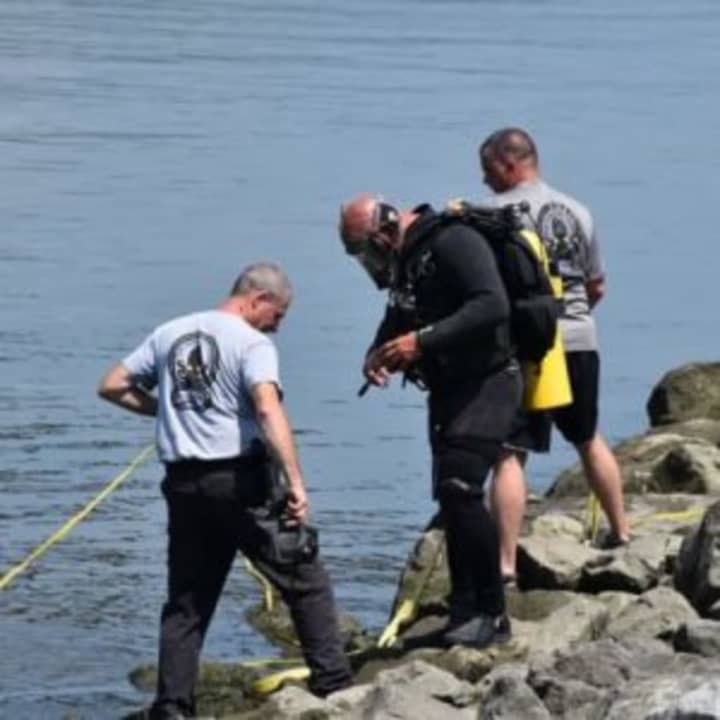 Diver&#x27;s work to bring Brenda Kerber&#x27;s vehicle to the surface from the bottom of the Muscott Reservoir.