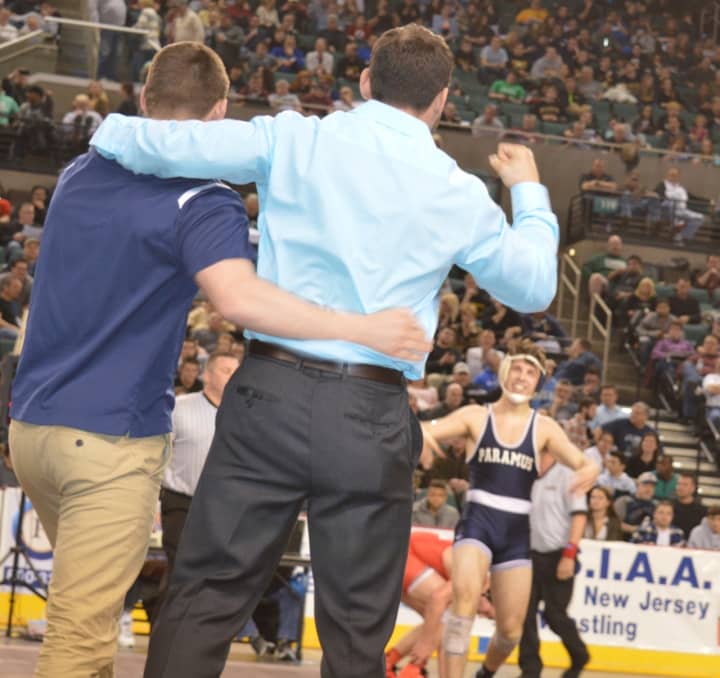 Paramus coaches celebrate as Kyle Cochran comes out of the NJSIAA semifinal round victorious.