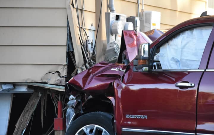 The GMC Sierra plowed into the foundation and garage of the corner house on Bogle Avenue at River Road in North Arlington around 5 p.m. Monday, May 8.