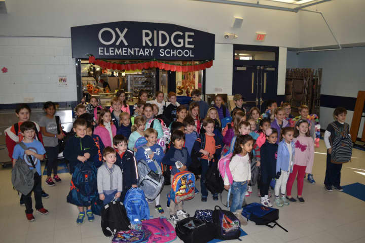 Ox Ridge kids with the backpacks collected.