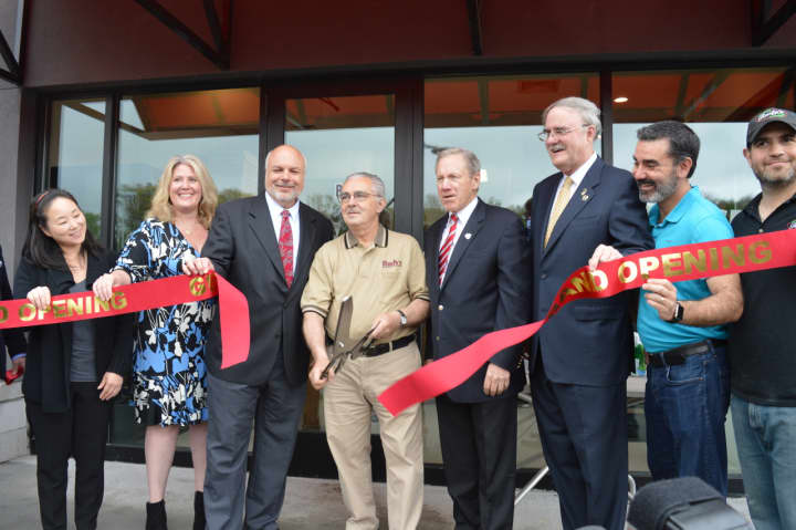Charlie Osso cuts the ribbon in front of the new location of Rudy&#x27;s in Closter Plaza.
