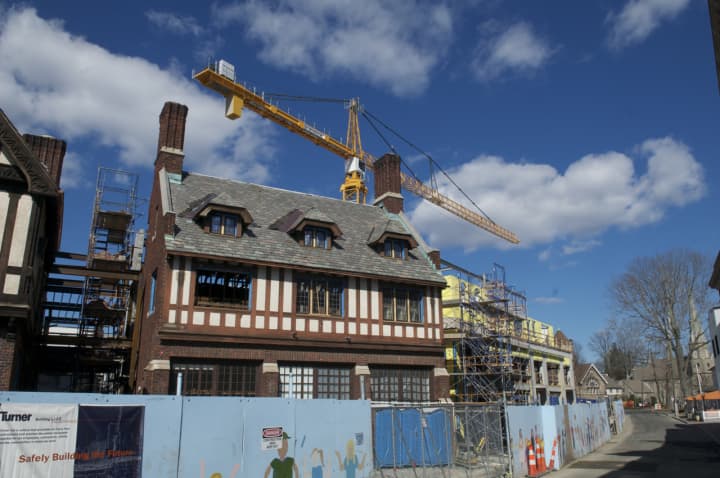A crane soars high above the Bedford Square project in downtown Westport.