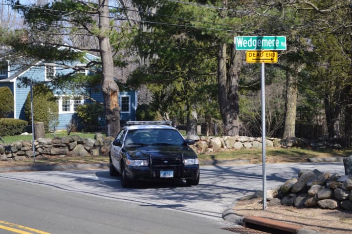 A Stamford police cruiser blocked Wedgemere Road Tuesday afternoon. Police are investigating an officer-involved shooting that occurred Monday night.