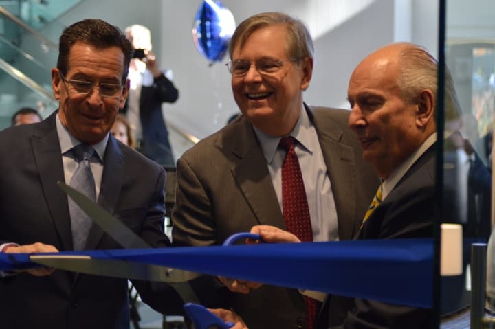 Gov. Dannel Malloy attends the ribbon cutting for the new Conair facility in Stamford on Monday with Mayor David Martin and Conair founder Lee Rizzuto Jr.