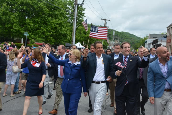 Gov. Andrew Cuomo, center, marches with fellow Town of New Castle resident, Chappaqua&#x27;s Hillary Clinton, far left, in downtown Chappaqua for the 2016 Memorial Day parade.