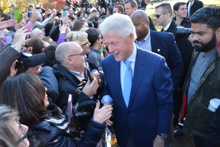 Bill Clinton meets with a crowd of supporters in Chappaqua.