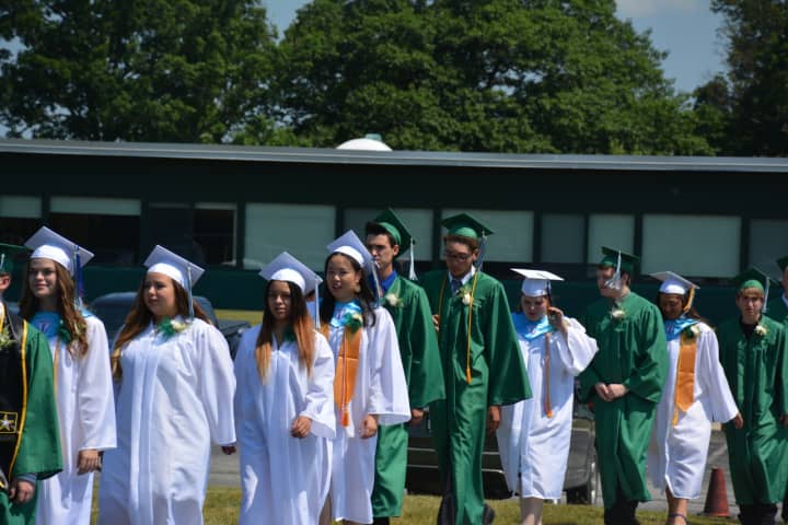 Members of Webutuck High School&#x27;s Class of 2016 march to their commencement.