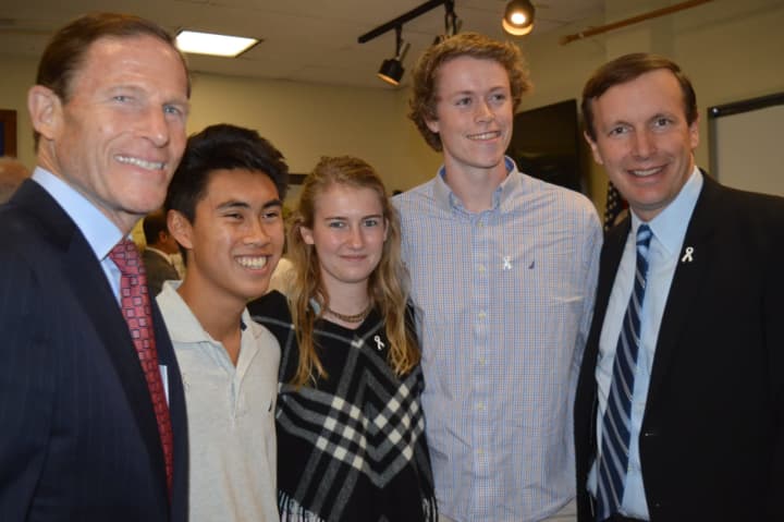 U.S. Sens. Richard Blumenthal, left, and Chris Murphy, right, pose with Fairfield Warde High School seniors Peter Hwang, Jacqueline Kaiser and Max Lee at a Domestic Violence Awareness Month roundtable in Fairfield.
