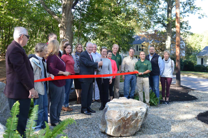 Fairfield First Selectman Mike Tetreau and Stephanie Barnes, president of the Greater Fairfield Board of Realtors, center, and town officials opened a new pocket park at Rockland Road and Wilson Street Thursday.