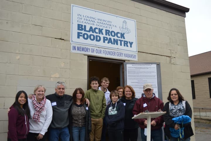 Volunteers serve families each weekend at the Black Rock Food Pantry in Bridgeport.