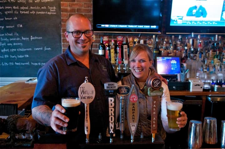 Clock Tower Grill Owners Rich and Cassie Parente serve up a variety of craft beers.