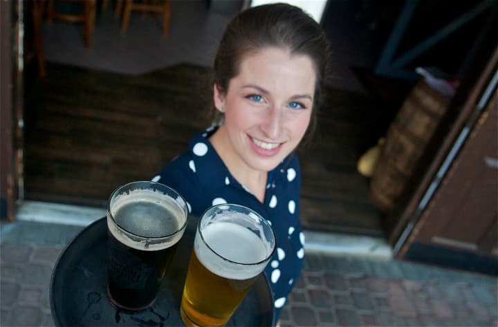 Clock Tower Grill&#x27;s Karen Angley delivers a few cold ones.