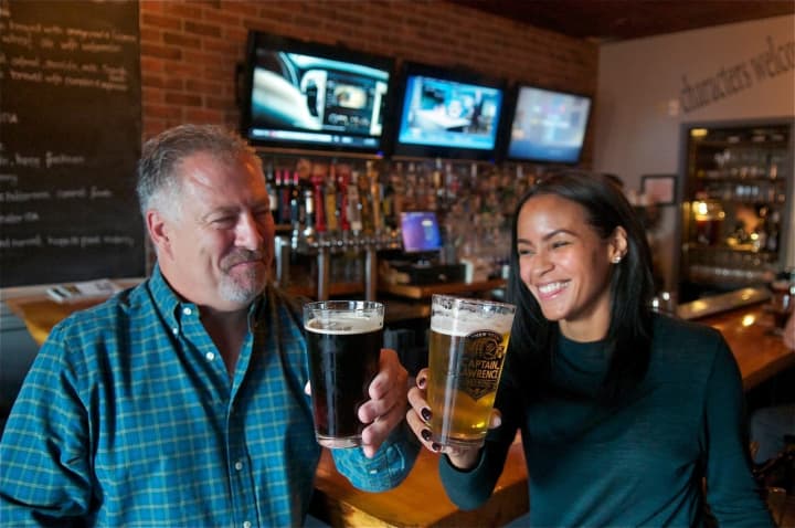 Customers enjoy a variety of craft brews available at Clock Tower Grill, a Putnam County participating restaurant.