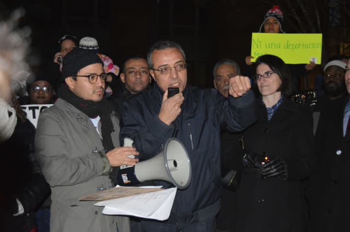 Fairfield University professor Ahmed Ebrahim addresses the crowd at a rally against President Trump&#x27;s executive order on immigration.