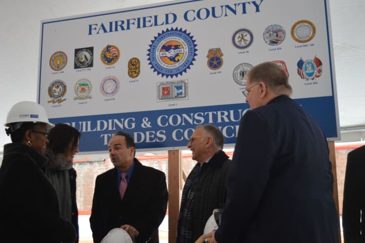 Bridgeport Mayor Joe Ganim, third from left, chats with city leaders and Gary Flocco, CEO of Corvus Capital Partners, which is developing the new Cherry Street Lofts.