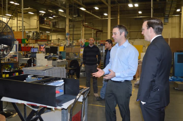 Manufacturing Manager Josh Bauer, left, gives U.S. Sen. Chris Murphy a tour of Lex Products in Shelton.
