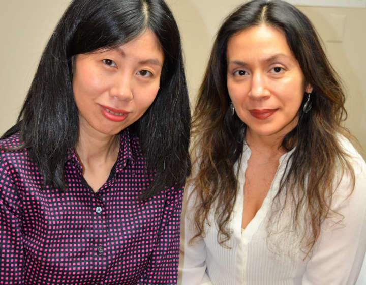 Acupuncturists Aili Zhu and Jannet Manteiga.