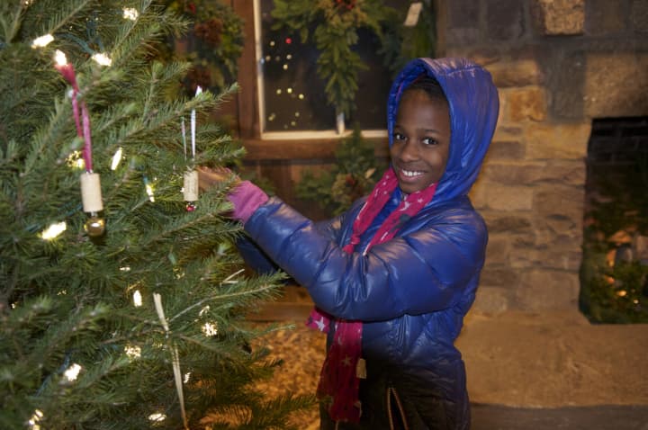 A girl checks out the tree ornaments at Jones Family Farms in Shelton last year.