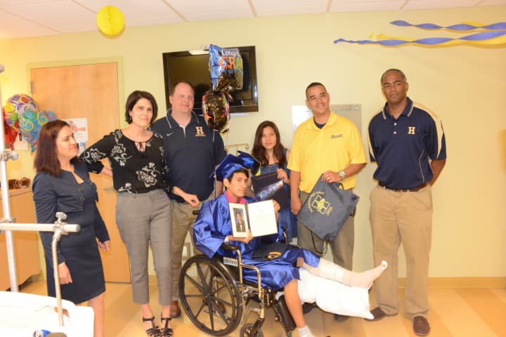 <p>L to R: Mother Marta Peralta, School Counselor Maggie Magner, Principal James Montesano, Jose Guallpa-Peralta, Sister Catherinne Peralta, Asst. Principals Dr. Anibal Galiana and Celso King.</p>